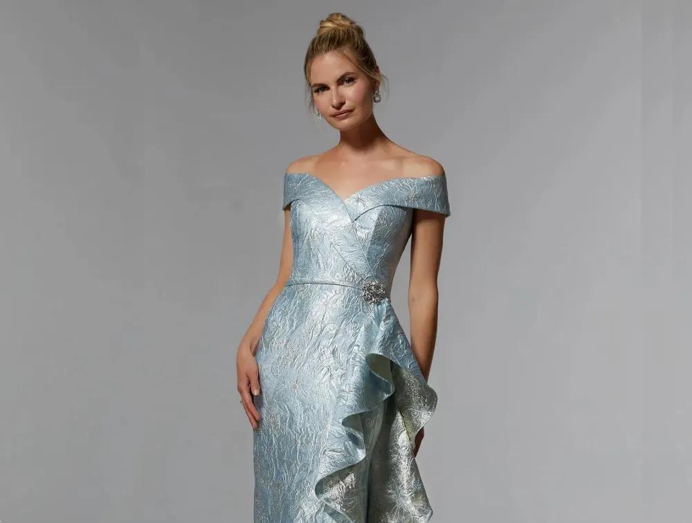 Model wearing a silver blue gown